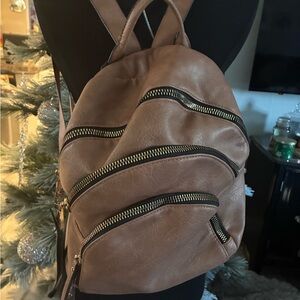 Stylish Tan Backpack with Zipper Accents